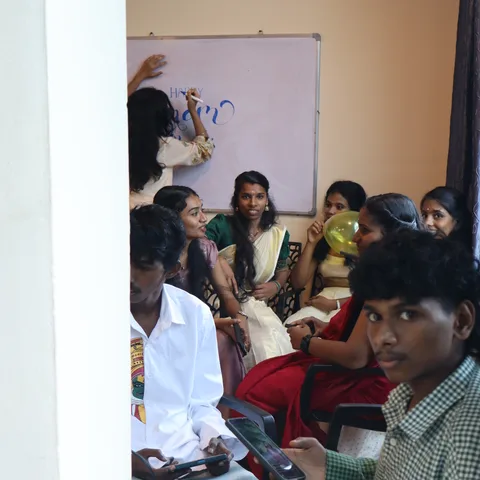 Hospital administration students during an Onam 2026 performance in the classroom at Treneywann, Kochi